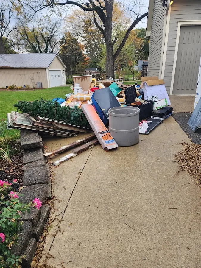 Dumpster being loaded with debris for Commercial Dumpster Rental in Birch Bay